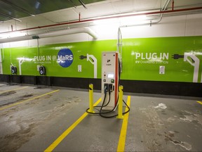 GE WattStations (wall mounted) and Electric Vehicle Chargers Ontario (EVCO), white free standing unit, at the parking lot under the MaRS Centre in Toronto, Ont. on Thursday January 18, 2018. Ernest Doroszuk/Toronto Sun)