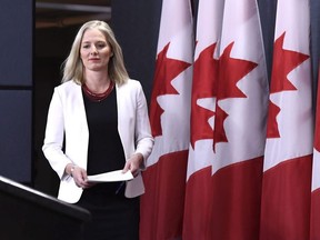 Minister of Environment and Climate Change Catherine McKenna arrives for a press conference on the government's environmental and regulatory reviews related to major projects, in the National Press Theatre in Ottawa on Thursday, Feb. 8, 2018.