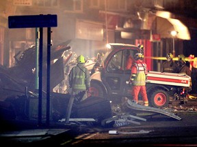 Emergency personnel attend the scene of an incident in Leicester, central England, Sunday Feb. 25, 2018. (Aaron Chown/PA via AP)