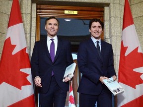 Finance Minister Bill Morneau and Prime Minister Justin Trudeau leave the prime minister's office to table the federal budget in the House of Commons in Ottawa on Tuesday, Feb. 27, 2018.