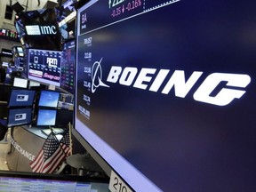 The Boeing logo appears above a trading post on the floor of the New York Stock Exchange on July 24, 2017.