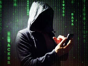 Computer hacker with mobile phone