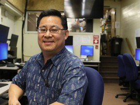 In this Feb. 1, 2018 photo, Jeffrey Wong, current operations officer for the Hawaii Emergency Management Agency, poses for a photo in Honolulu. He filed a police report after seeing threatening comments online from people who confused him with being the agency employee who mistakenly sent a missile alert. He wants to set the record straight that he's not the so-called "button-pusher" and was on a different island when the alert was sent from Honolulu on Jan. 13.
