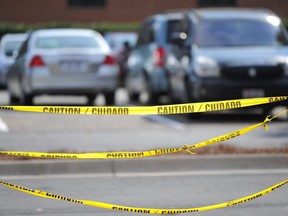 In this stock photo, caution tape is hung up at a parking lot.