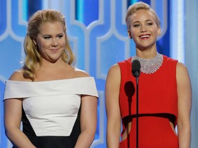 In this handout photo provided by NBCUniversal, Presenters Amy Schumer and Jennifer Lawrence speak onstage during the 73rd Annual Golden Globe Awards at The Beverly Hilton Hotel on January 10, 2016 in Beverly Hills, California. (Photo by Paul Drinkwater/NBCUniversal via Getty Images)