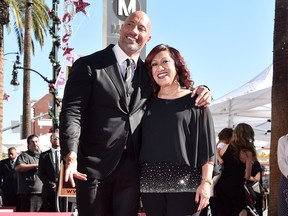 Actor Dwayne Johnson and mother Ata Johnson attend a ceremony honoring Dwayne Johnson with the 2,624th star on the Hollywood Walk of Fame on December 13, 2017 in Hollywood, California.