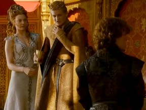 King Joffrey (Jack Gleeson, centre) drinks poison in this scene from "Game of Thrones." (Video screenshot)