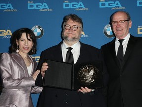 The Shape of Water director Guillermo del Toro is flanked by actors Sally Hawkins and Richard Jenkins after winning of the outstanding directorial achievement award in feature films at the 2018 DGA Awards at the Beverly Hilton in Beverly Hills, Calif., Feb. 3, 2018. (FayesVision/WENN.com)