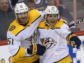 Nashville Predators forward Ryan Hartman (right) celebrates his game-winning goal against the Winnipeg Jets late in the third period in Winnipeg with forward Austin Watson on Feb. 27, 2018. (KEVIN KING/Winnipeg Sun)