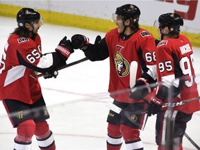 Senators winger Mike Hoffman (68) celebrates his game-winning goal against the Sabres on Thursday with Matt Duchene, left, and Erik Karlsson.