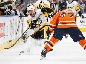 Oscar Klefbom of the Edmonton Oilers keeps an eye on Patric Hornqvist of the Pittsburgh Penguins at Rogers Place on Nov. 1, 2017