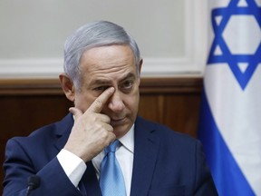 Israeli Prime Minister Benjamin Netanyahu chairs the weekly cabinet meeting at the Prime Minister's office in Jerusalem, Sunday, Feb. 11, 2018.