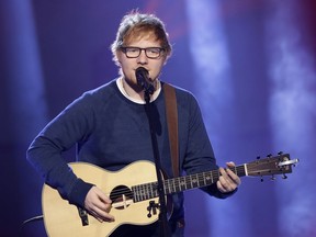FILE - In this file photo dated Sunday, March 12, 2017, British singer Ed Sheeran performs during the Italian State RAI TV program "Che Tempo che Fa", in Milan, Italy.