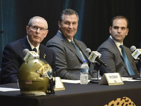 In this Jan. 12, 2017, file photo, from left, Tom Coughlin, Doug Marrone and general manager Dave Caldwell listen as Jacksonville Jaguars NFL football team owner Shad Khan speaks during a press conference at EverBank Stadium in Jacksonville, Fla. (Bob Self/The Florida Times-Union via AP, File)