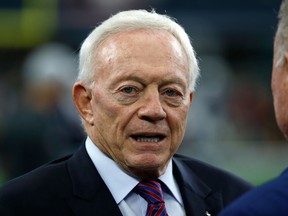 In this Nov. 23, 2017, file photo, Dallas Cowboys team owner Jerry Jones stands on the field as the team warms up before an NFL football game against the Los Angeles Chargers in Arlington, Texas