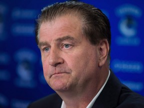 Vancouver Canucks general manager Jim Benning listens during a news conference in Vancouver, B.C., on Tuesday September 12, 2017.  (THE CANADIAN PRESS/Darryl Dyck)