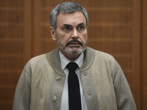 John Ausonius attends the trial in a courtroom in Frankfurt, Germany, Wednesday, Feb. 21, 2018.  The regional court has sentenced the Swede to life in prison for shooting dead a woman in Frankfurt 26 years ago.