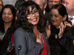 Liberal MP Iqra Khalid is welcomed by her colleagues as she arrives to make an announcement about an anti-Islamophobia motion on Parliament Hill in Ottawa on Feb. 15, 2017.
