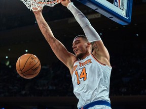 In this Nov. 11, 2017, file photo, New York Knicks' Willy Hernangomez dunks against the Sacramento Kings during the second half of a NBA basketball game at Madison Square Garden in New York