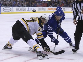 Boston Bruins Patrice Bergeron watches the draw during the first period in Toronto on Sunday ( Jack Boland/Toronto Sun/Postmedia Network)