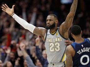 Cleveland Cavaliers' LeBron James celebrates after making the game-winning basket in overtime in an NBA basketball game against the Minnesota Timberwolves on Feb. 7, 2018