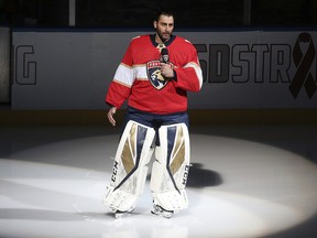 Florida Panthers goaltender Roberto Luongo (1) talks to fans about the shooting at Marjory Stoneman Douglas High School, prior to a game against the Washington Capitals, Thursday, Feb. 22, 2018, in Sunrise, Fla. (AP Photo/Joel Auerbach)