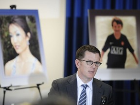 This Sept. 2, 2011 file photo Dr. Jonathan Lucas, of the San Diego County Medical Examiner's Office, talks about his department's findings in front of photos of Rebecca Zahau, left and Max Shacknai at a news conference in San Diego. (AP Photo/Denis Poroy,File )