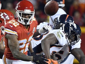 Kansas City Chiefs defensive back Marcus Peters (22) goes after a ball he stripped from Denver Broncos running back Jamaal Charles (28) in Kansas City, Mo., Monday, Oct. 30, 2017. (AP Photo/Ed Zurga)