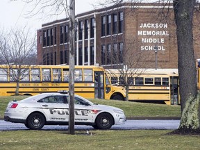 A police car is parked outside Jackson Township Middle School, Tuesday, Feb. 20, 2018 in Massillon, Ohio.