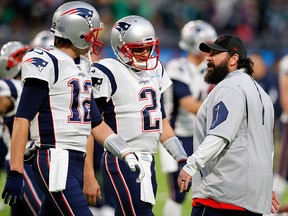 Tom Brady and Brian Hoyer of the New England Patriots talk to defensive coordinator Matt Patricia during warm-ups prior to Super Bowl LII against the Philadelphia Eagles at U.S. Bank Stadium on February 4, 2018 in Minneapolis. (Kevin C. Cox/Getty Images)
