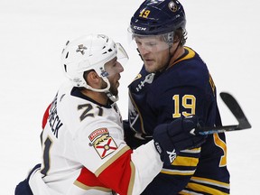 Buffalo Sabres defenceman Jake McCabe (19) and Florida Panthers Vincent Trocheck (21) exchange words Thursday, Feb. 1, 2018, in Buffalo, N.Y. (AP Photo/Jeffrey T. Barnes)