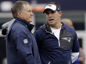 In this Oct. 2, 2016, file photo, New England Patriots head coach Bill Belichick, left, and offensive coordinator Josh McDaniels talk before a game against the Buffalo Bills in Foxborough, Mass. (AP Photo/Elise Amendola, File)