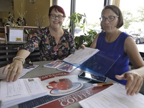 Pasco County Commission candidates Kelly Smith, left, and Brandi Geoit prepare forms for their Galentine's Day meeting Monday, Feb. 12, 2018, in Lutz, Fla.