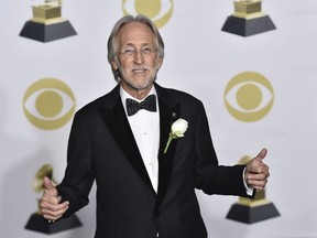 FILe - In this Jan. 28, 2018 file photo, President of The Recording Academy Neil Portnow poses in the press room at the 60th annual Grammy Awards in New York. The Recording Academy is reassuring its members that they are not behind the music industry when it comes to female representation. In a letter sent to members on Thursday, Feb. 15, obtained by The Associated Press, the academy offers statistics to show that women had a larger presence at the Grammys compared to the industry standard.