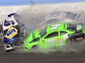 Chase Elliott (9), Kasey Kahne (95) and Danica Patrick (7) crash during the NASCAR Daytona 500 at Daytona International Speedway in Daytona Beach, Fla., Sunday, Feb. 18, 2018.