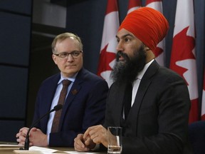 NDP leader Jagmeet Singh, right, and NDP finance critic Peter Julian speak at a press conference as they unveil the NDP's top priorities ahead of the federal budget on Tuesday, February 13, 2018.