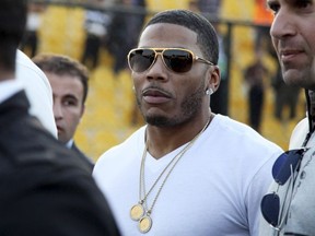 In this March 13, 2015 file photo, rapper Nelly approaches the stage for a concert in Irbil, northern Iraq.