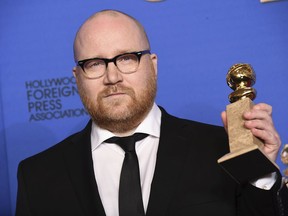 In this Jan. 11, 2015 file photo, Johann Johannsson poses in the press room with the award for best original score for "The Theory of Everything" at the 72nd annual Golden Globe Awards at the Beverly Hilton Hotel in Beverly Hills, Calif.