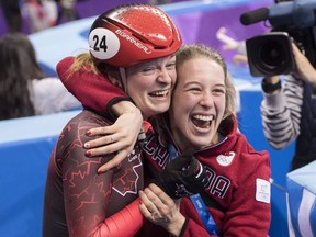 Canada's Kim Boutin is hugged by teammate Marianne St-Gelias after finding out she has won the bronze medal in the women's 500-metre short-track speedskating final at the Pyeonchang Winter Olympics Tuesday, February 13, 2018 in Gangneung, South Korea.