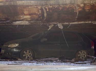 A damaged car lies underneath a collapsed overpass in Brasilia, Brazil, Tuesday, Feb. 6, 2018. (AP Photo/Eraldo Peres)