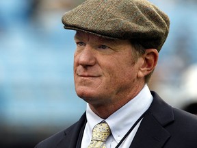 This Oct. 7, 2012, file photo shows Carolina Panthers general manager Marty Hurney watching the Panthers warm up before a game against the Seattle Seahawks, in Charlotte, N.C. (AP Photo/Nell Redmond, File)