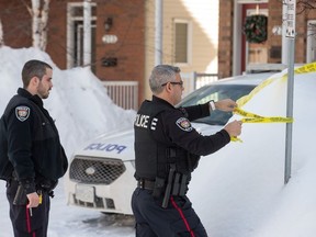 Police maintain a secure perimeter around a townhome at 277 Parkrose Private in east end of Orleans.