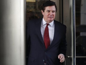 In this Nov. 6, 2017 photo, Paul Manafort, President Donald Trump's former campaign chairman, leaves the federal courthouse in Washington.