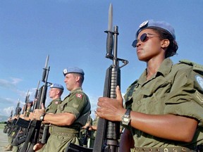 In this file photo, Canadian Peacekeepers prepare for a parade at Maple Leaf Camp in Port-au-Prince on Nov. 28, 1997.
