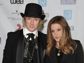 In this May 10, 2012 file photo, Lisa Marie Presley, at right, and her husband, Michael Lockwood, arrive at NARM Music Biz 2012 Awards, at The Hyatt Regency in Century City, Calif.