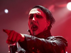 In this Aug. 2, 2015 file photo, Marilyn Manson performs in concert during the "End Times Tour 2015" at the Susquehanna Bank Center, in Camden, N.J.