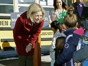 Alberta Premier Rachel Notley (left) meets children at Monsignor Fee Otterson School in southwest Edmonton on Friday March 17, 2017.