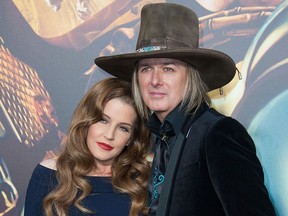 Lisa Marie Presley (L) and Michael Lockwood. (VALERIE MACON/AFP/Getty Images)