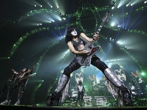 Lead singer Paul Stanley rips it as they play the first song of the night Psycho Circus.. Legendary heavy metal rockers, KISS, were in Toronto at the Molson Amphitheatre on Tuesday August 12, 2014 performing on their 40th anniversary tour.