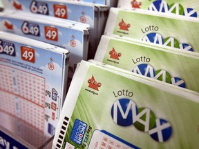 Lotto MAX and Lotto 649 tickets. Theres an unclaimed last week's $64-million 6/49 jackpot on at the OLG headquarters on Tuesday October 27, 2015. Dave Abel/Toronto Sun/Postmedia Network ORG XMIT: POS1610131950541269